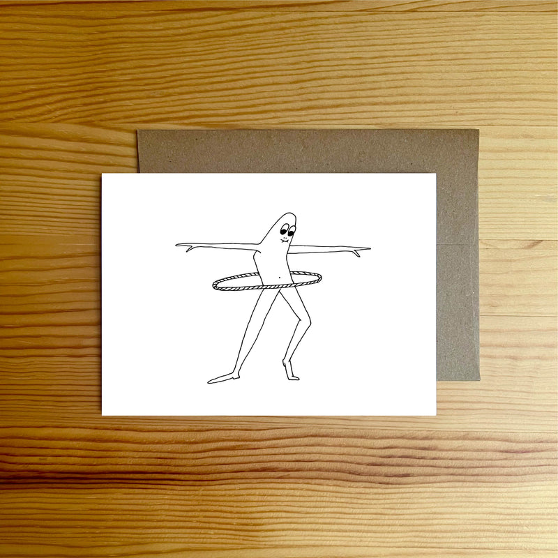 Man playing with a hula hoop